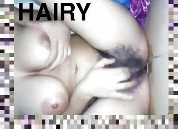 Hairy chick masturbates