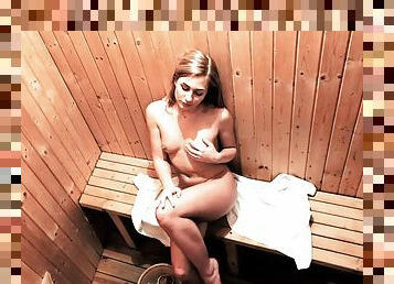 Yummy girl caresses her peach on the sauna