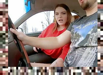 A girl gives a blowjob while the guy drives the car