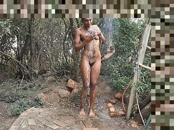 Dark tattooed desi slut taking a shower in the woods at a nude resort