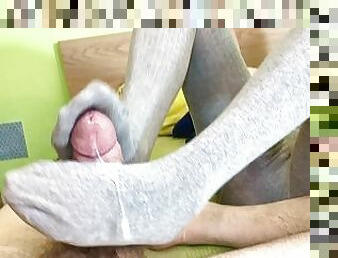 Footjob in gray pantyhose