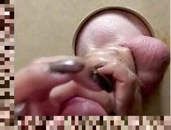 Nails teasing through gloryhole handjob