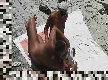 Quick handjob on the beach from his lovely wife