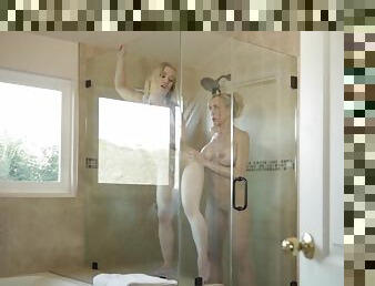 Brandi Love pleasures young blondie in the bathroom