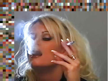 Perverted blonde is smoking in a sexy way