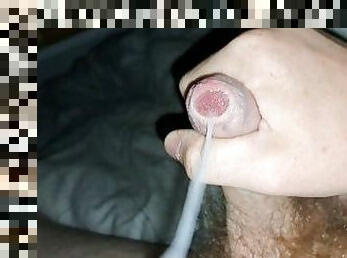 Precum beneath foreskin before releasing a massive load