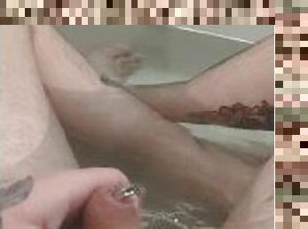Pissing in bath with pierced cock