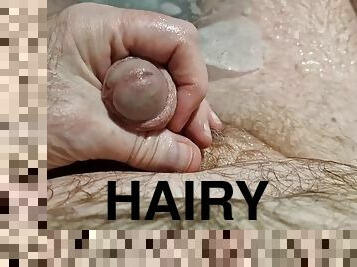 A nice hot bath playing with my ball sack and letting the urine flow all over my hairy body.