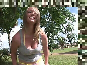 Blonde skank shows her natural tits and nice butt in a park