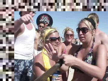 An outdoors beach party with pretty blondes in glasses